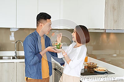 Asian Lovers feeding fruit and food to each other, Couple and Family concept Stock Photo