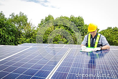 Asian male electrical engineer Supervise and supervise the installation of solar cell systems Stock Photo