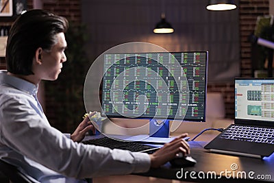 Asian man analyzing stock market trade Stock Photo