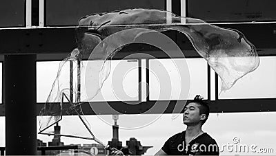 Asian man during artistic performances soap bubble blowing show Editorial Stock Photo