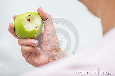 Asian man bite green apple and scurvy Stock Photo