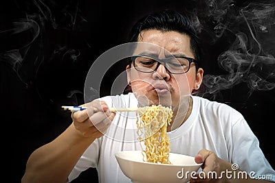 Asian man eating Instant noodles very hot and spicy Stock Photo