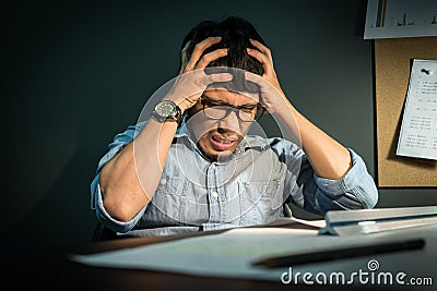 Asian man feeling exhausted. Stock Photo