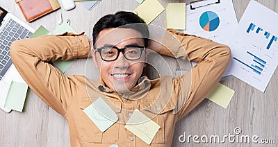 Asian man feels happy when he completes work on time Stock Photo