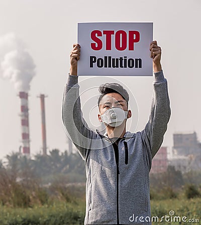 Man hold stop pollution sign Stock Photo