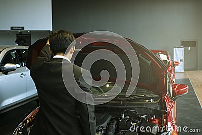 Asian man open door car with technology engine on blurry background.For automotive or Maintenance, service or transport automotive Stock Photo