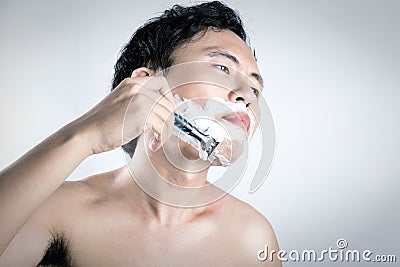 Asian man is shaving Stock Photo