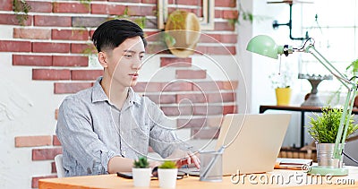 Asian man telework at home Stock Photo