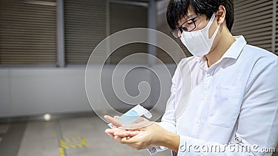 Asian man using hand sanitizer gel washing hand Stock Photo
