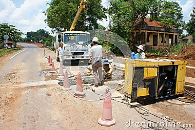 Asian man, Vietnamese worker, construction project Editorial Stock Photo