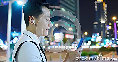 Asian man wear wireless earbuds Stock Photo