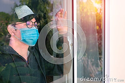 Asian man wearing medical mask and quarantine revival from illness at home. Stock Photo