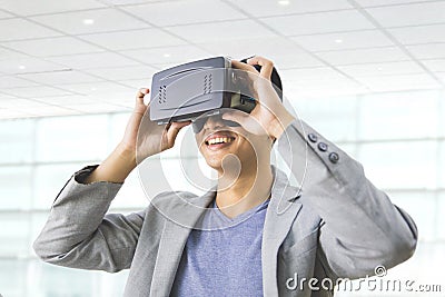 asian man wearing virtual reality goggle Stock Photo