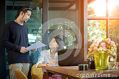 Asian man and woman freelance working at home office Stock Photo