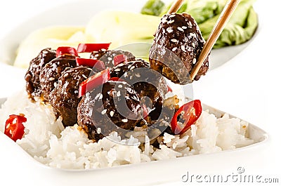 Asian meatballs with chinese sauce served with rice Stock Photo