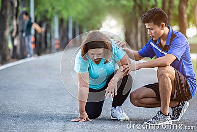 Asian man make encouragement to fat woman who sitting on ground Stock Photo