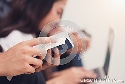 Asian men`s hand holding and reading books with background of As Stock Photo