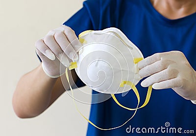 Asian Men Wear Medical Gloves And Hold Medical Masks N95. Stock Photo