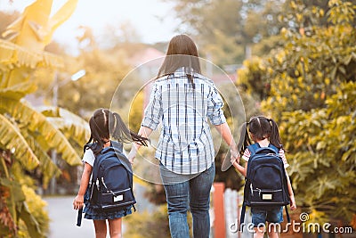 Asian mother and daughter pupil girl going to school Stock Photo