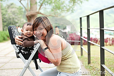 Asian mother with her 7 month old baby girl Stock Photo