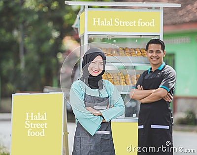 Asian muslim small food stall owner Stock Photo