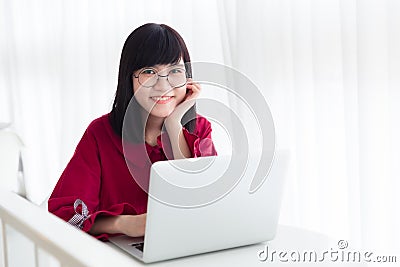 Asian nerdy teen happy smile with laptop computer Stock Photo