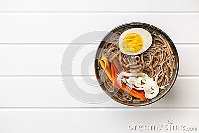 Asian noodle soup with soba noodles, vegetable and egg in bowl Stock Photo