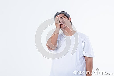 Asian obese men with gray hair are suffering from headaches Stock Photo