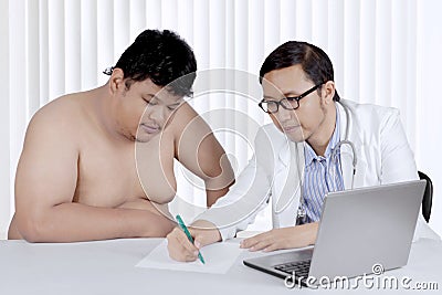 Asian overweight patient with a doctor Stock Photo