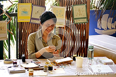 Asian Painter in Action Editorial Stock Photo