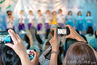 Asian parents recording vdo and photo shooting in their kids school event, Bangkok, Thailand Editorial Stock Photo