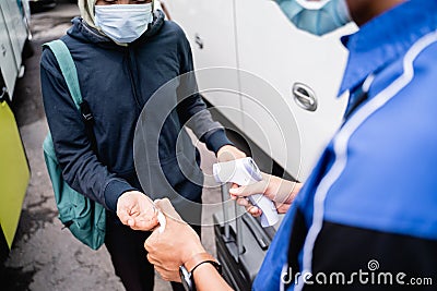 Asian passenger temprature check and hand sanitize Stock Photo