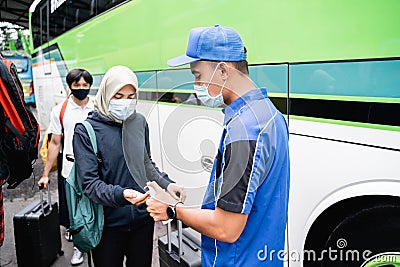 Asian passenger temprature check and hand sanitize Stock Photo
