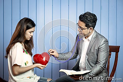 Asian Pastor Listen to Young Sad Beautiful Girl with Her Broken Stock Photo