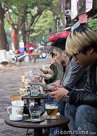 Asian people drinking coffee on the sidewalk Editorial Stock Photo