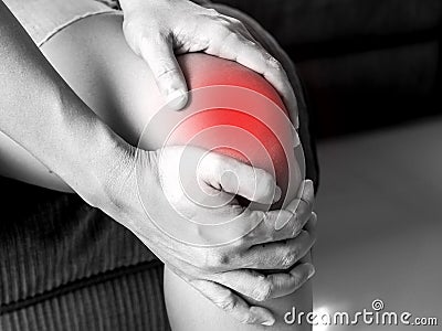 Asian people have knee pain, pain from health problems in the body. Stock Photo