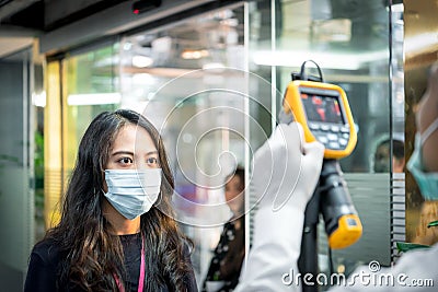 People waiting for temperature check by thermoscan Stock Photo