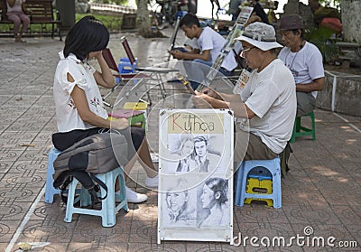 Asian portrait painter drawing sketch of customer by pencil Editorial Stock Photo