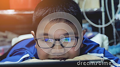 Asian preteens watching on tablet computer , smile face. Stock Photo