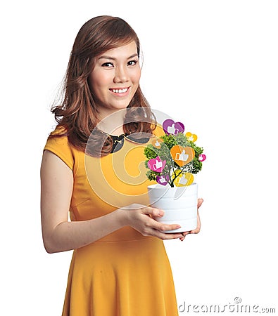 Asian pretty woman with pot of Facebook like plant Stock Photo