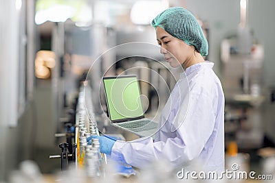 Asian professional food scientist checking and control quality of beverage Stock Photo