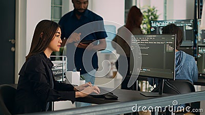Asian programer typing big data code on computer to work on app developing program Stock Photo