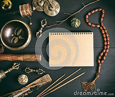 Asian religious musical instruments for meditation and notebook Stock Photo