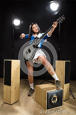 Asian rock star lady in studio Stock Photo