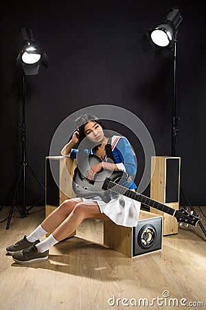 Asian rock star lady in studio Stock Photo