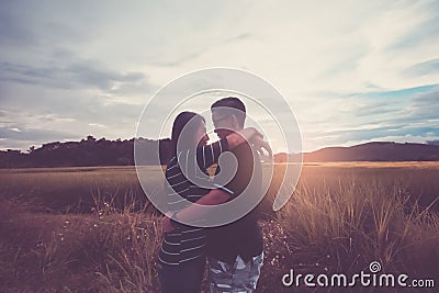 Asian,Romantic couple or Homosexuality, female love hug on the rice field with sunset, Valentine`s Day Stock Photo
