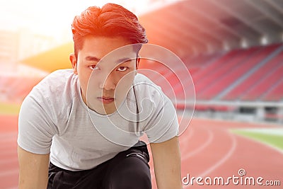 Asian runner men with focus eyes committed forward Stock Photo