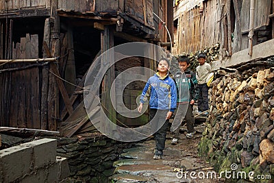 Asian rural, peasant, farmer, kids teens walk around Chinese village. Editorial Stock Photo