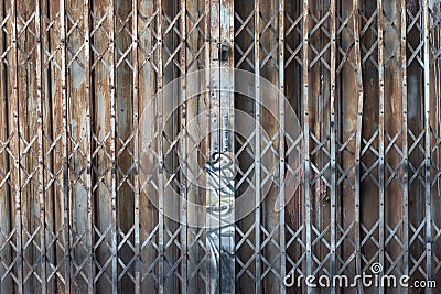 Asian rusty folding doors or traditional gate. Stock Photo