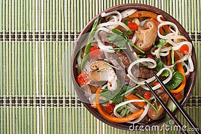 Asian salad vegetables, meat, mushrooms and rice noodle Stock Photo